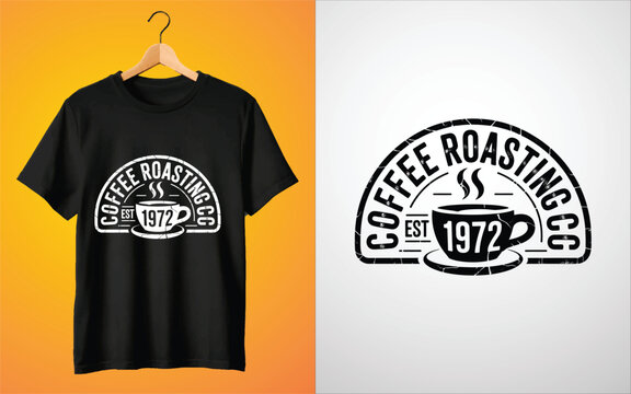 Black t-shirt featuring a white distressed print of a coffee cup and text reading coffee roasting co est 1972 on a hanger display