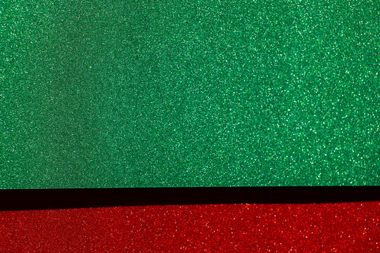  green glitter field with a red sparkling border and copy space for Christmas greetings,website headers, seasonal discounts and retail advertising.Christmas holiday sale