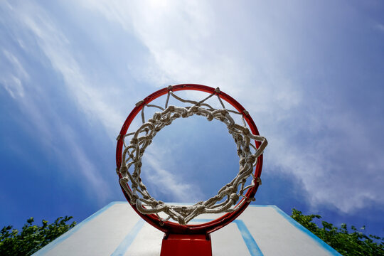 Basketball hoop and net on a sunny day