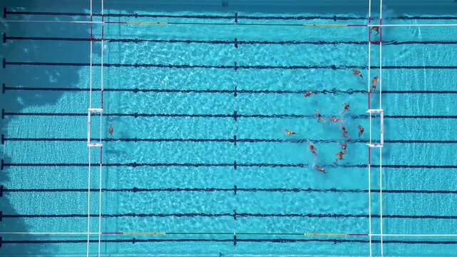 Top Down Aerial View of Water Polo Players Passing Ball During Match Game