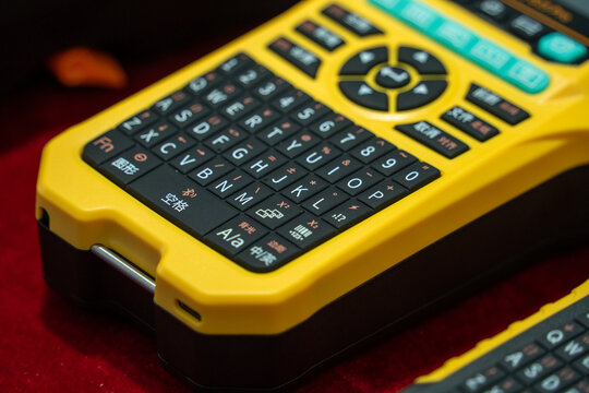 Handheld Electronic Device with QWERTY Keyboard and Control Pad
