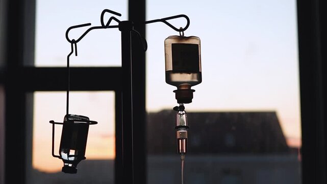 Hospital, healthcare and closeup of IV drip for medicine, infusion and medication dose for patient. Wellness, clinic and people with liquid antibiotics for treatment, sickness and medical service