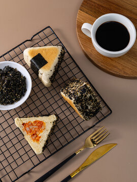 Triangle shaped savory breads with seaweed and filling for breakfast