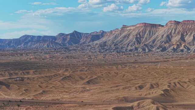 Book Cliffs desert Mesa Clifton Grand Junction aerial drone Colorado sunny afternoon summer blue sky clouds Grand Mesa Parachute Fruita Loma Delta i70 cars Colorado River forward upward motion
