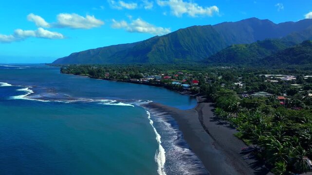 Taharuu Beach landscape volcanic black sand beach Mount Orohena Tahiti coastline French Polynesia aerial drone view Papeete Vaira'o surfspot South Pacific Ocean waves crash shore circle left