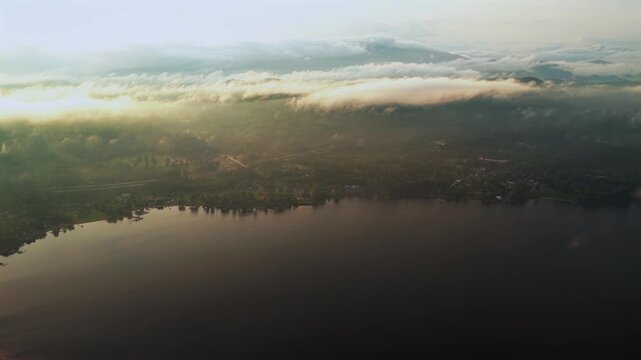 Lake Schroon golden hour sunset rainy mist low clouds s aerial drone Steep Bay Town of Schroon Lake Up State New York Pharaoh Mtn Adirondack Mountains July summer harbor view lake homes landscape