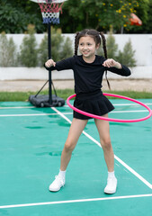 Young girl jumping rope outdoors © chachamp