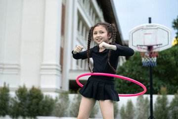 Young girl jumping rope outdoors © chachamp