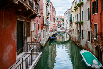 Narrow Venice Canal With Boats and Stone Bridge © Ruslan Bolgov