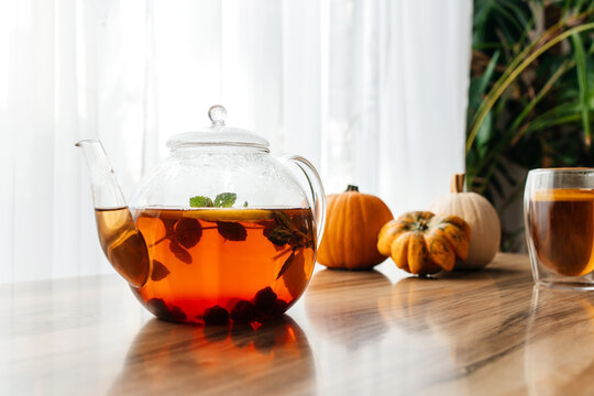Autumn tea set with pumpkins and knitted scarf