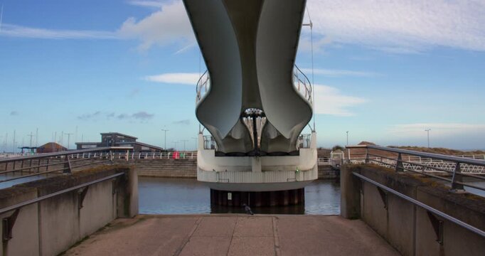 2x speed Wide end on shot of Pont y Ddraig, Dragon's Bridge opening up at Rhyl harbour.