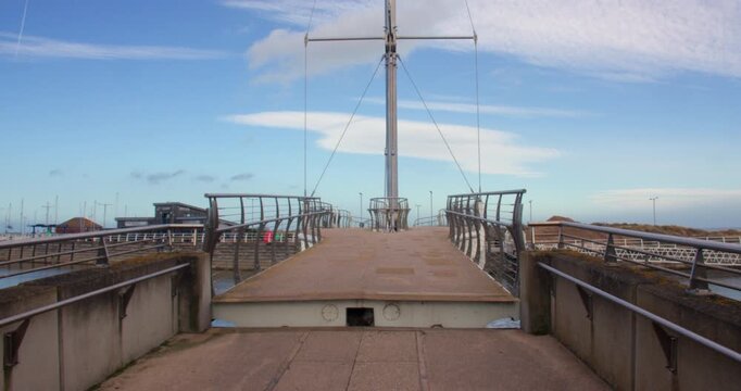 Wide end on shot of Pont y Ddraig, Dragon's Bridge opening up at Rhyl harbour.