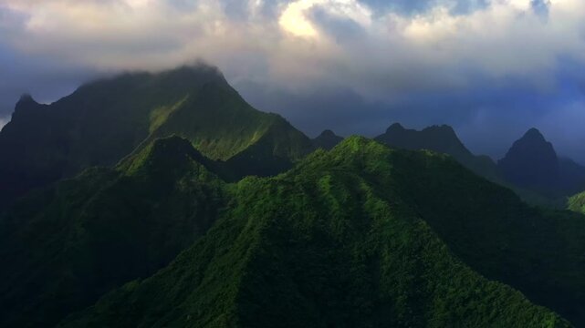 Mountains peaks of Teahupo'o Tahiti Ito Volcano South Pacific Ocean Island French Polynesia aerial drone sunset sunny cloud movement Tara Huhurahi Ridge Mount Ronui Aorai Orohena Vaiau River Valley