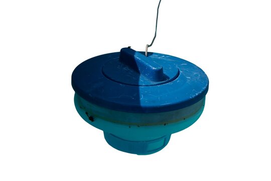 Blue floating pool chlorine dispenser isolated on a white background