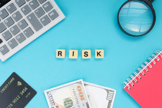 Financial Loss and Security Assessment with Credit Card and Money Against Blue Background