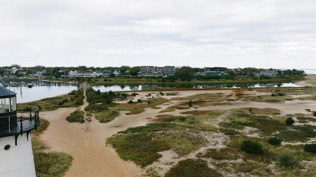 Aerial view of Edgartown lighthouse overlooking harbor landscape in Martha Vineyard.