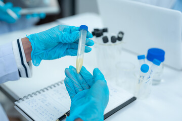 Naklejka premium Lab work, Scientist analyzing biological sample for virus detection in modern laboratory.