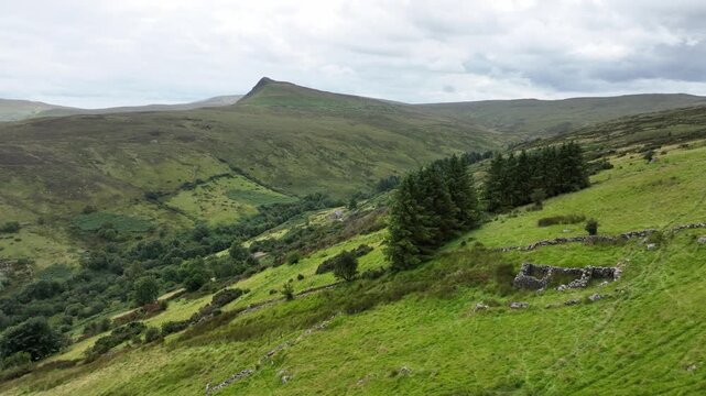 wild Irish Mountainside, cottage ruins and distant hills, Glens of Antrim rolling countryside and the rugged beauty of Northern Ireland.