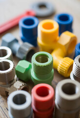 Fototapeta premium Plumbing and construction supplies, colorful plastic and metal pipe fittings for home improvement and DIY projects
