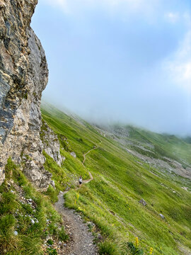 Hiking trail in alpine fog above Les Contamines-Montjoie, France