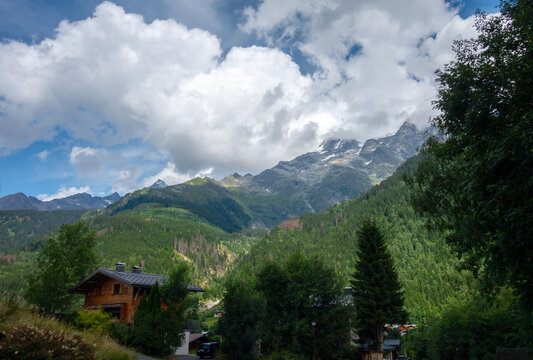 Wooden chalet in Les Contamines Montjoie under mountain peaks