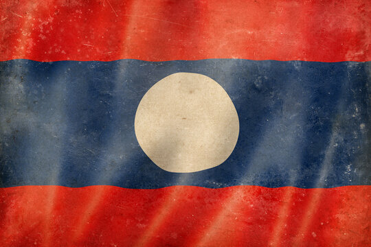 Old vintage flag of Laos, worn and stained