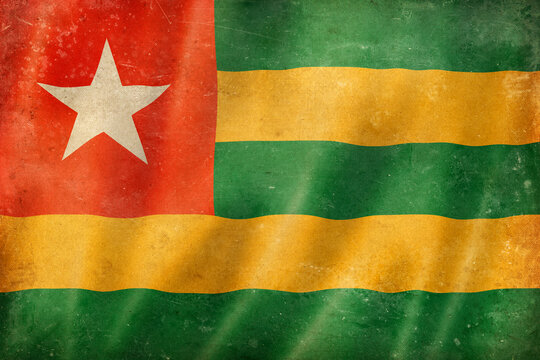 Old vintage flag of Togo, worn and stained