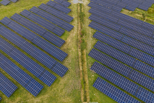 Aerial view of Rathnaskilloge 110kV Solar Farm Substation with rows of photovoltaic panels arranged across green fields in County Waterford, Ireland.