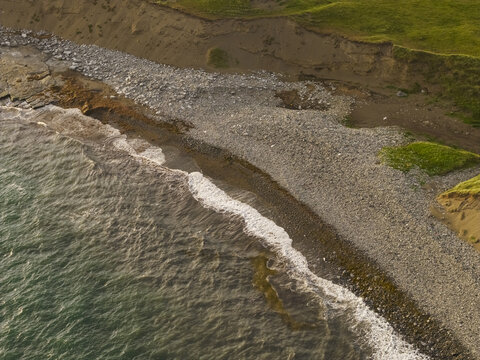 Aerial view of the rugged coastline and rocky beach in Doolin, County Clare, Ireland.
