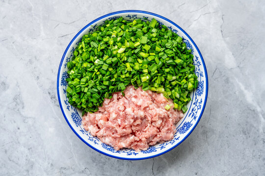 Nutritious and Healthy Dumpling Filling &ndash; A Bowl of Chopped Garlic Chives and Minced Pork