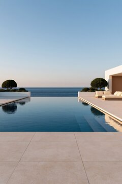 Infinity pool with tiled terrace and modern villa seating by the sea background for luxury resort wallpaper and serene design