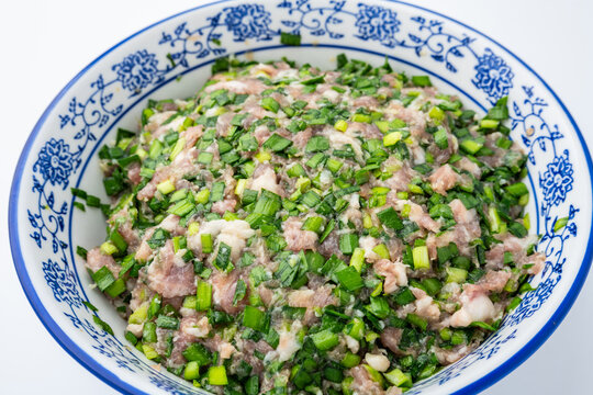 A bowl of chive and pork filling