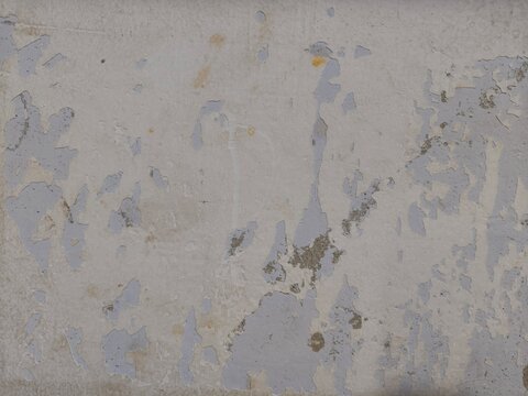 Grunge concrete wall texture with peeling white paint and weathered gray plaster provides industrial background for vintage design and urban construction concepts.