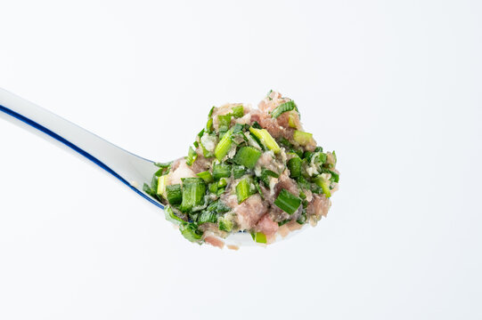 A spoonful of chive and pork filling