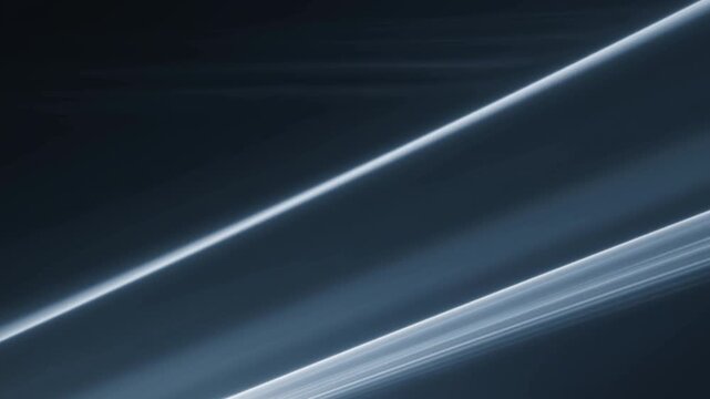 Abstract blue light beams crossing dark background with diagonal glowing lines