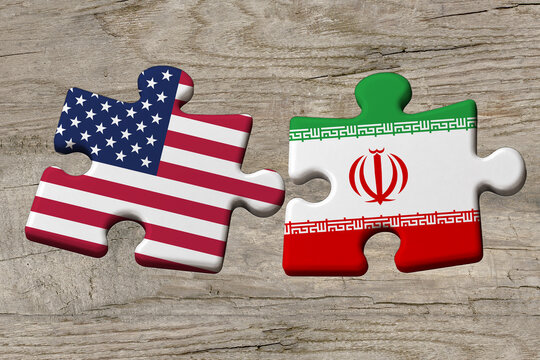 3D illustration. Flag of USA and Iran on a jigsaw puzzle pieces on a wood background.