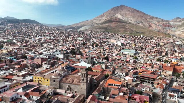 Epic aerial video of the dense historic city of Potosi with the legendary Cerro Rico mountain in the background, Bolivia.