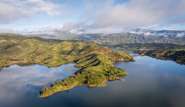 Lake Casitas reservoir and green hills beneath morning clouds