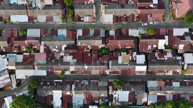 High angle perspective of closely packed rooftops in an urban neighborhood in South Kalimantan
