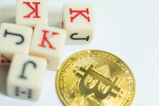 Physical bitcoin and casino dice in macro view The Concept of crypto trading and chance
