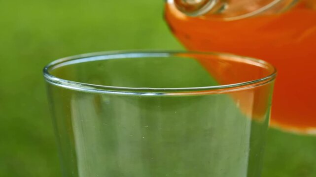 Pouring Orange Juice into a Glass
