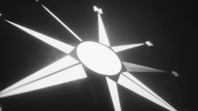 Black and white animated compass with glowing white accents on dark background for travel, direction, and navigation themes