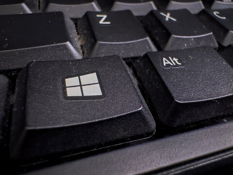 Calgary, Alberta, Canada. August 24, 2026. Extreme macro close-up of a Windows key and Alt key on a black desktop computer keyboard.