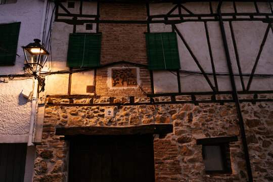 Traditional Half Timbered Stone House with Vintage Street Lamp in Old Spanish Village