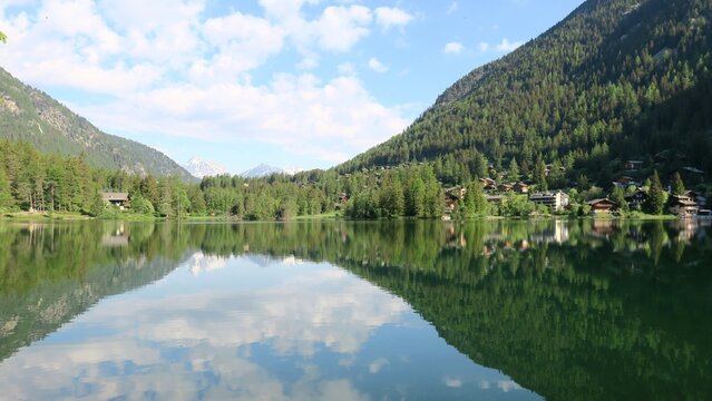 Reflections on Lac de Champex along the Tour du Mont Blanc, Switzerland