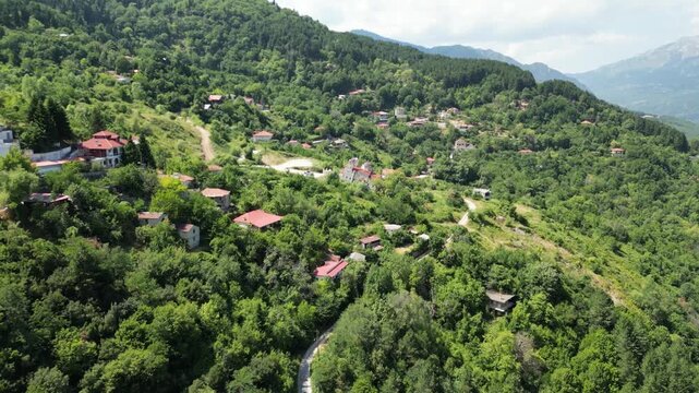 Drone flying over famous tilted leaning Church of Agia Paraskevi in abandoned sinking village of Ropoto near Trikala Thessaly Greece stock video. High quality 4k footage