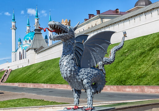 Metal sculpture of Zilant on the background of Kazan Kremlin with Qol Sharif Mosque, Russia