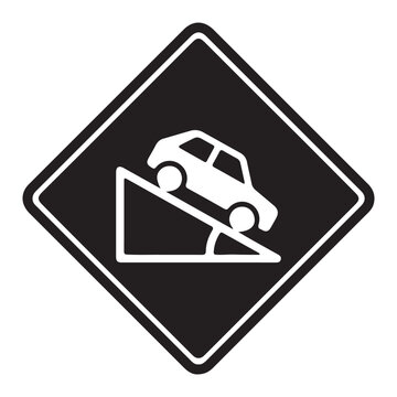 Black diamond warning sign showing a car being towed on a ramp, indicating a vehicle removal zone.