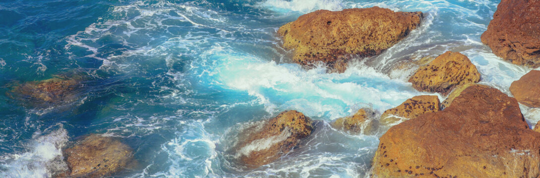 Rocky beach with big brown stones