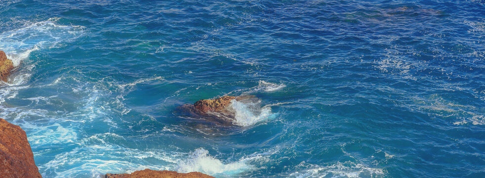 Rocky beach with big brown stones